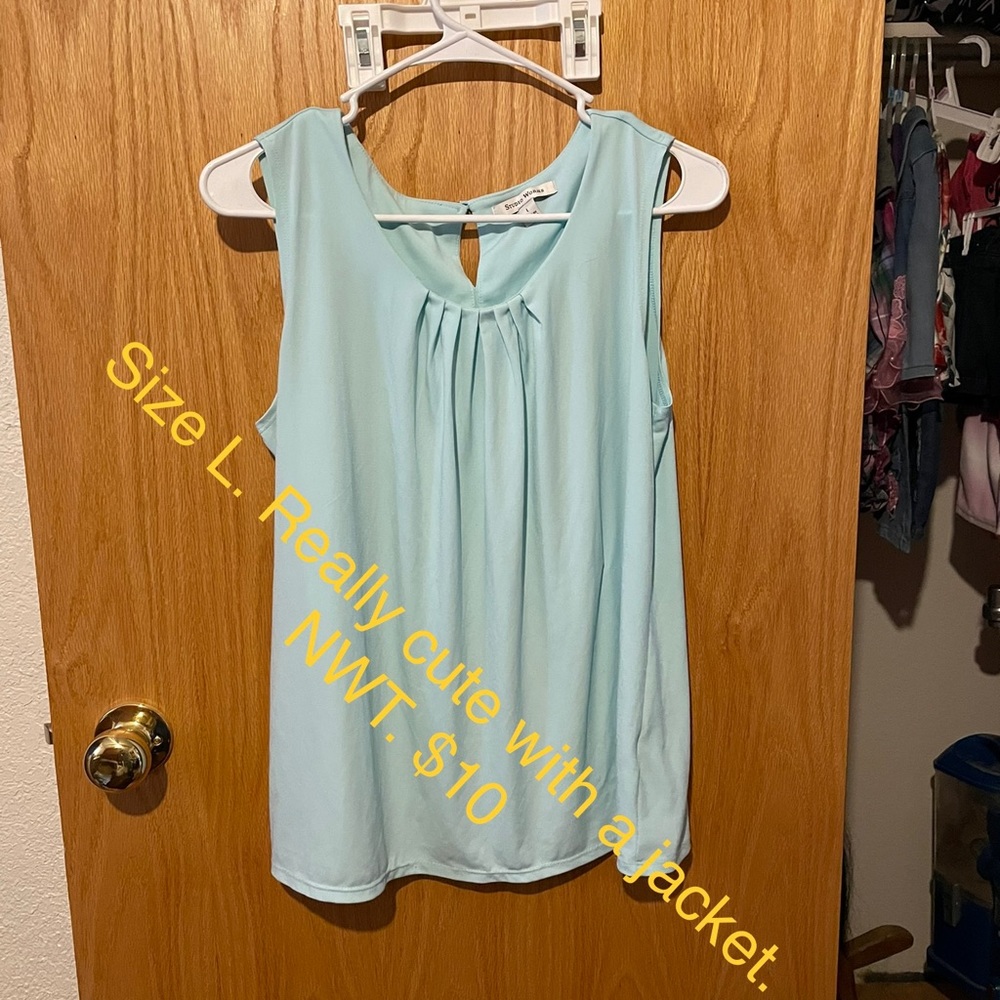 Light blue blouse.